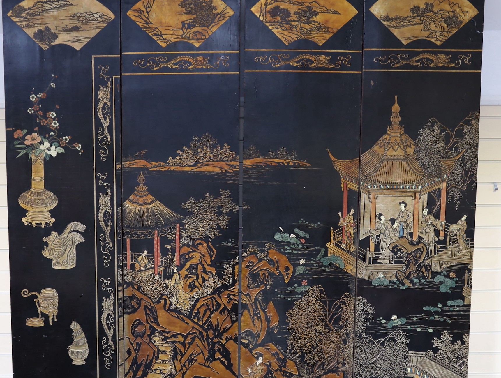 A tall Chinese coromandel lacquer twelve panel screen, 19th century, each leaf panel width 49cm, height 264cm